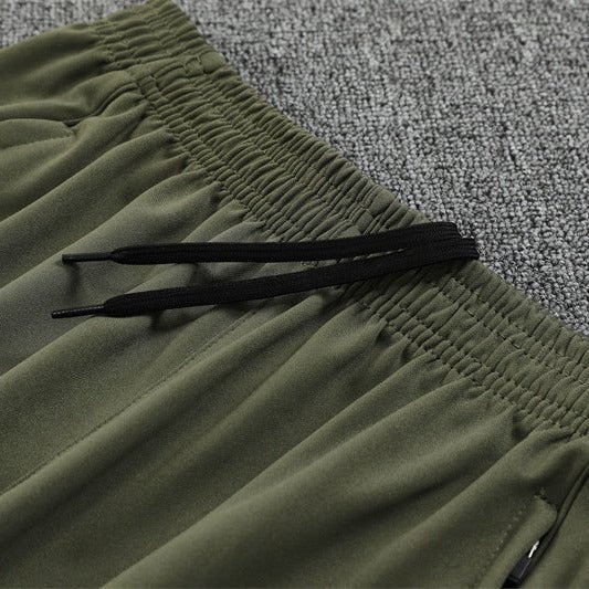 25/26 Real Madrid Training Dark Olive Tracksuit from FootballPrestige.shop - Premium Concept kits
